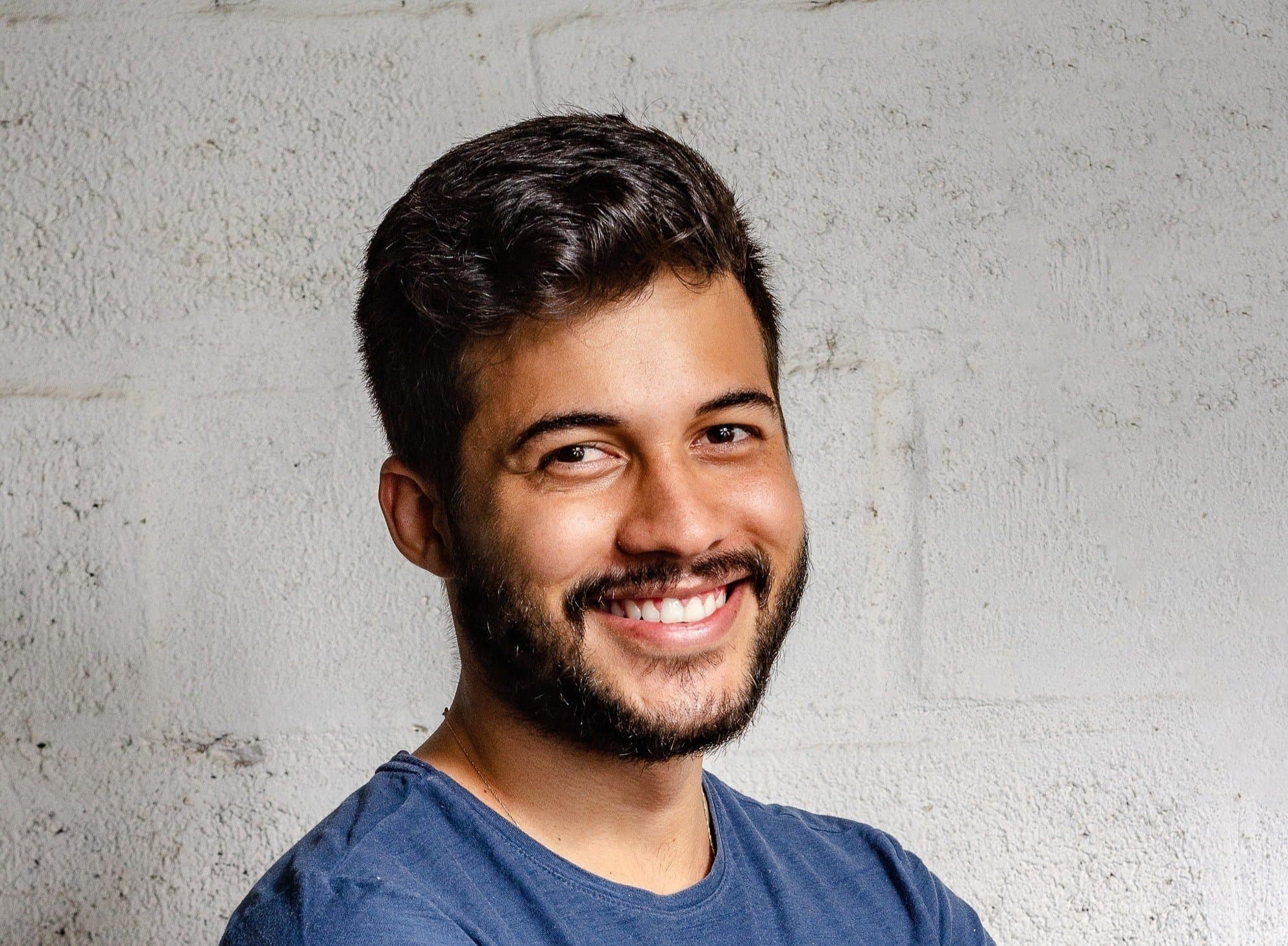 A man smiling with a complete smile restored by dental implants at Align Dental Surgery